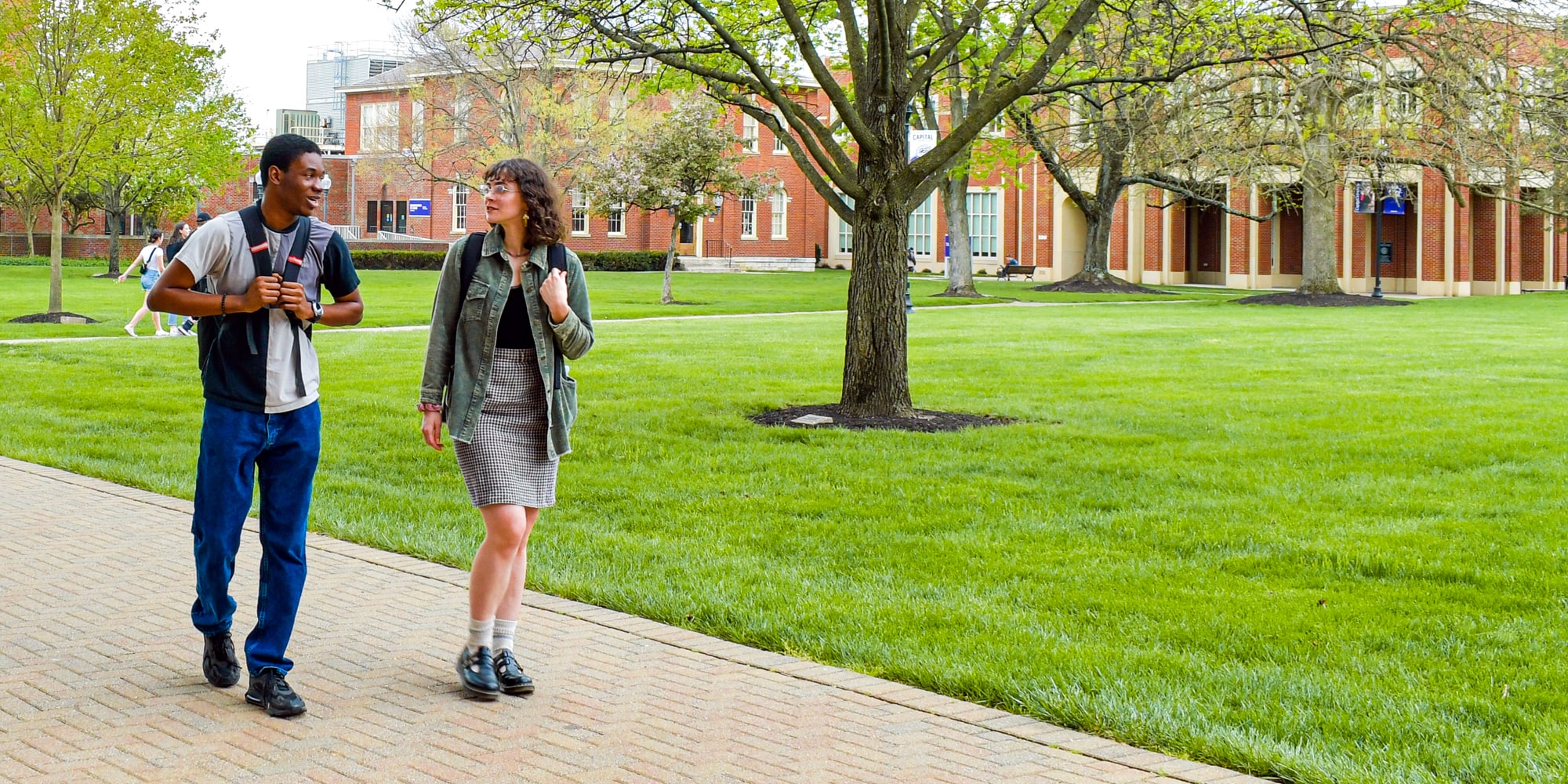 Students Walking By Library Min